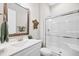 Bathroom featuring a large mirror, tiled shower, and white vanity at 3037 Freeman Farm Way, Rolesville, NC 27571