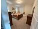 Comfortable bedroom with a cozy window seat, a wooden dresser, and natural light streaming in from the window at 3037 Freeman Farm Way, Rolesville, NC 27571