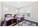 Cozy bedroom with two beds, a large window, and a decorative rug at 3037 Freeman Farm Way, Rolesville, NC 27571