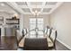 Formal dining area with a coffered ceiling, chandelier, and large window at 3037 Freeman Farm Way, Rolesville, NC 27571