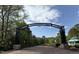 Main Street Park entrance with a brick walkway, landscaping, and decorative archway at 3037 Freeman Farm Way, Rolesville, NC 27571