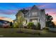 Charming two-story home with well-manicured lawn and mature trees creating curb appeal at 3037 Freeman Farm Way, Rolesville, NC 27571