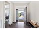 Bright foyer showcases hardwood floors and an open front door view of the home's exterior at 3037 Freeman Farm Way, Rolesville, NC 27571