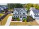 An aerial view shows the front exterior and landscaped front yard of this two-story home at 3037 Freeman Farm Way, Rolesville, NC 27571
