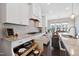 Modern kitchen features white cabinetry, granite countertops, stainless steel appliances, and convenient pull out storage at 3037 Freeman Farm Way, Rolesville, NC 27571