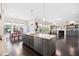 Spacious kitchen with a large island and view into living room and dining area at 3037 Freeman Farm Way, Rolesville, NC 27571