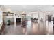 Spacious living room featuring dark hardwood flooring, and a fireplace at 3037 Freeman Farm Way, Rolesville, NC 27571