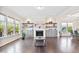 Spacious living room boasts a fireplace, custom built-ins, hardwood floors, and large windows for ample natural light at 3037 Freeman Farm Way, Rolesville, NC 27571