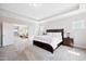 Spacious primary bedroom featuring a tray ceiling and an open doorway to the sitting area at 3037 Freeman Farm Way, Rolesville, NC 27571
