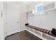 Convenient mudroom features a built-in bench, storage cubbies, and hooks for organizing coats and bags at 3037 Freeman Farm Way, Rolesville, NC 27571