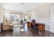 Inviting home office featuring a comfortable seating area, a desk, and ample natural light at 3037 Freeman Farm Way, Rolesville, NC 27571