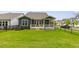A fenced backyard with green grass and a covered deck is perfect for outdoor living at 33 Highpointe Dr, Pittsboro, NC 27312