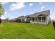 A well-maintained lawn is fenced and provides views of neighboring houses in the community at 33 Highpointe Dr, Pittsboro, NC 27312