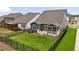 Fenced backyard with lush green grass and cozy screened in porch at 33 Highpointe Dr, Pittsboro, NC 27312