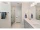 Modern bathroom with a glass-enclosed shower, double vanity, and stylish fixtures at 33 Highpointe Dr, Pittsboro, NC 27312