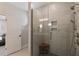 Modern bathroom featuring a glass shower with tiled walls and updated shower head fixture at 33 Highpointe Dr, Pittsboro, NC 27312