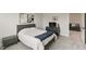 This bedroom features neutral walls, carpet, queen bed, and a dresser with TV at 33 Highpointe Dr, Pittsboro, NC 27312