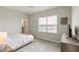 Bedroom featuring neutral decor, large window, and minimalist furniture at 33 Highpointe Dr, Pittsboro, NC 27312