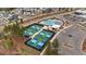 Aerial showcasing community amenities: pool, pickleball courts, and parking area at 33 Highpointe Dr, Pittsboro, NC 27312