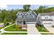 Charming two-story home with a well-maintained lawn and attached two-car garage at 33 Highpointe Dr, Pittsboro, NC 27312