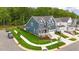 Corner lot home with lush green grass, black fencing, and sidewalks in a modern neighborhood at 33 Highpointe Dr, Pittsboro, NC 27312