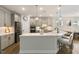 Spacious kitchen features an island, stainless steel appliances, and pendant lighting at 33 Highpointe Dr, Pittsboro, NC 27312