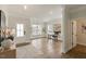 Bright living room features hardwood floors, modern lighting, and neutral color scheme at 33 Highpointe Dr, Pittsboro, NC 27312