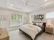 Bright bedroom with tray ceiling, ceiling fan, plush carpet, and abundant natural light at 33 Highpointe Dr, Pittsboro, NC 27312