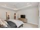 Cozy main bedroom featuring a tray ceiling, recessed lighting, and neutral color palette at 33 Highpointe Dr, Pittsboro, NC 27312