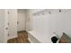 Bright mudroom with a built-in bench and storage, next to the door at 33 Highpointe Dr, Pittsboro, NC 27312