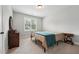 Inviting bedroom offers natural light and features a dresser and side table at 3545 Donlin Dr, Wake Forest, NC 27587