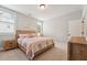 Charming bedroom with natural light offers a decorative wall and comfortable bed at 3545 Donlin Dr, Wake Forest, NC 27587