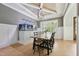 Elegant dining room with a unique aquarium feature, modern lighting, and stylish decor at 3545 Donlin Dr, Wake Forest, NC 27587