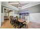 Dining room featuring a coffered ceiling, a view into the living room, and a striking built-in aquarium at 3545 Donlin Dr, Wake Forest, NC 27587