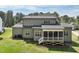 Two-story home with a screened in porch, and a well-maintained lawn at 3545 Donlin Dr, Wake Forest, NC 27587