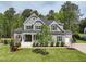 Beautiful two-story home featuring a landscaped front yard and charming front porch at 3545 Donlin Dr, Wake Forest, NC 27587