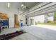 Spacious garage with ample storage and workspace, providing secure parking and organization at 3545 Donlin Dr, Wake Forest, NC 27587
