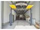 Well-equipped garage with a car lift, providing space for vehicle maintenance and storage at 3545 Donlin Dr, Wake Forest, NC 27587