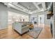 Spacious living room with stylish furnishings, open layout, and seamless connection to the modern kitchen at 3545 Donlin Dr, Wake Forest, NC 27587