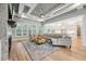 Open living room with coffered ceilings, fireplace, and seamless flow to the modern kitchen at 3545 Donlin Dr, Wake Forest, NC 27587
