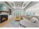 Inviting living room with coffered ceilings, fireplace, built-ins, and seamless flow to kitchen at 3545 Donlin Dr, Wake Forest, NC 27587