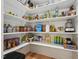 Well-stocked pantry featuring ample shelving and a variety of food items, enhancing kitchen storage and organization at 3545 Donlin Dr, Wake Forest, NC 27587
