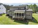Inviting screened porch with white railings and gray siding, perfect for relaxing outdoors at 3545 Donlin Dr, Wake Forest, NC 27587