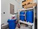 Functional utility room features storage tanks, water filtration system, and space for supplies at 3545 Donlin Dr, Wake Forest, NC 27587
