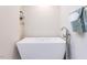 Modern bathroom featuring a soaking tub with chrome hardware and white walls at 3608 Burwell Rollins Cir, Raleigh, NC 27612