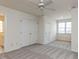 Bedroom with closet, windows, and neutral carpet, offering a bright and spacious feel at 3608 Burwell Rollins Cir, Raleigh, NC 27612