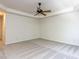 Spacious bedroom featuring a tray ceiling, neutral carpeting and a lighted ceiling fan at 3608 Burwell Rollins Cir, Raleigh, NC 27612