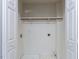 Large closet with bifold doors, a clothes hanging rack and utility connections at 3608 Burwell Rollins Cir, Raleigh, NC 27612