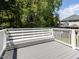 Exterior of the home featuring a built-in bench seat overlooking the wooded yard at 3608 Burwell Rollins Cir, Raleigh, NC 27612