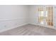 Office room showcasing carpeted floors, double glass doors, and natural lighting at 3608 Burwell Rollins Cir, Raleigh, NC 27612